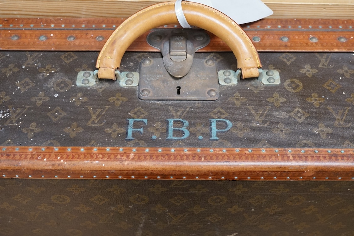A vintage Louis Vuitton monogram suitcase with two original keys, numbered 793692 to the linen covered interior, height 22cm, width 76cm, depth 46cm